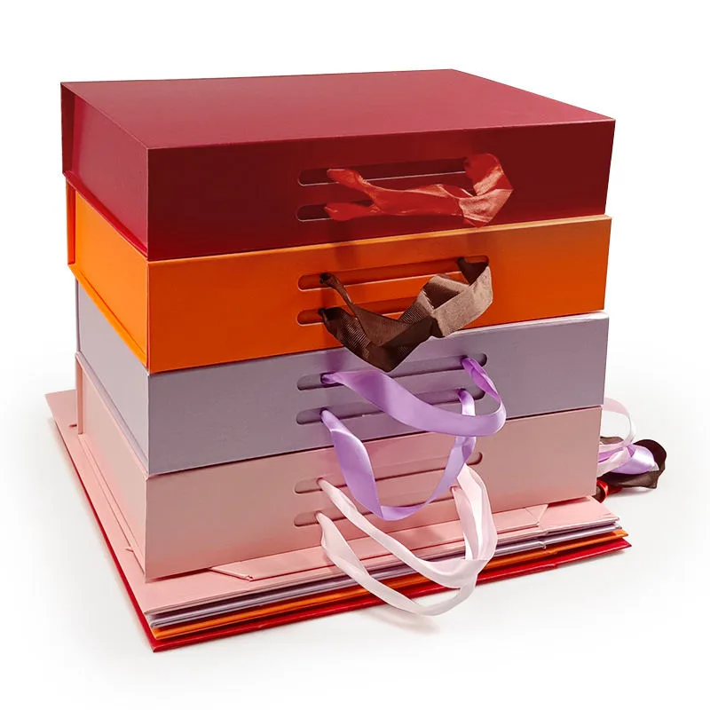 Magnetic folding box with ribbon handle showing assembly and closure