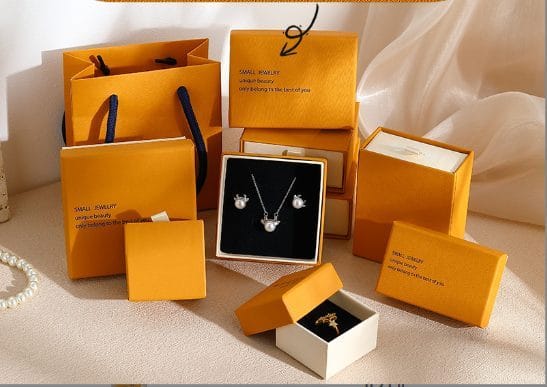 Orange jewelry gift packaging set with matching paper bag