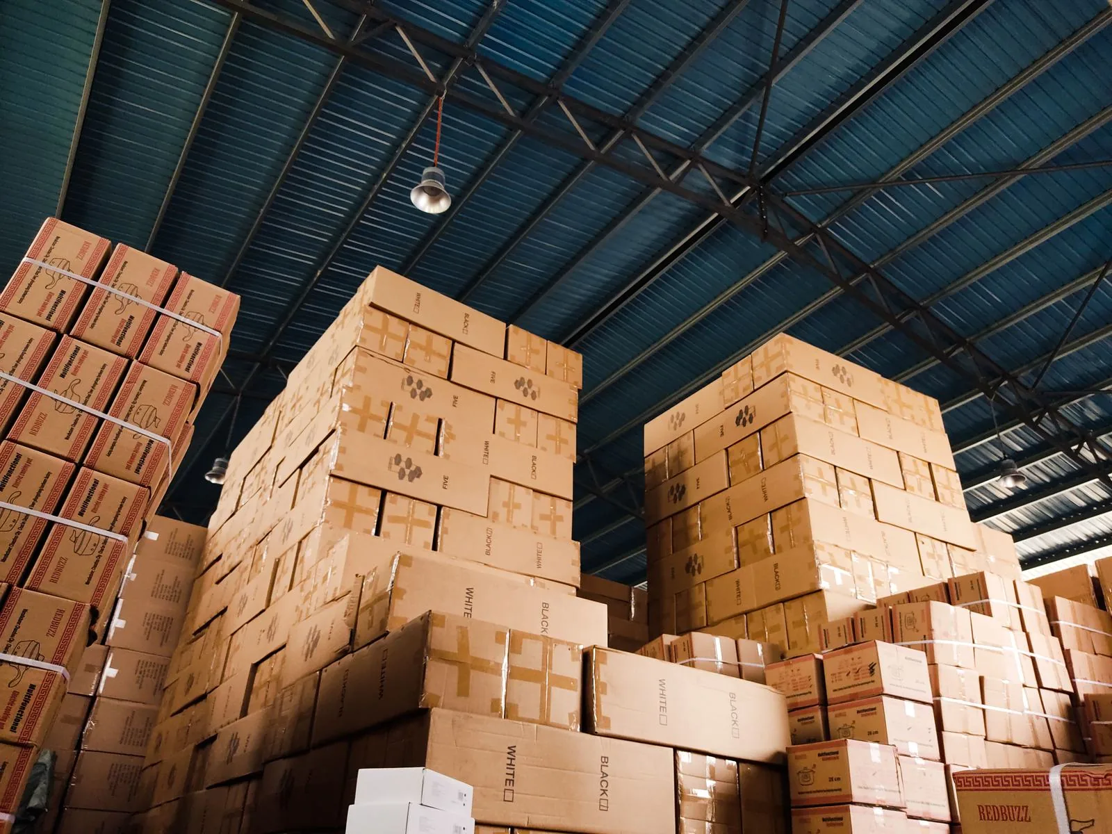 Stacked corrugated mailer blanks for storage and fulfillment planning
