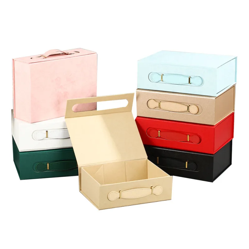 Magnetic folding gift boxes with decorative carry handles