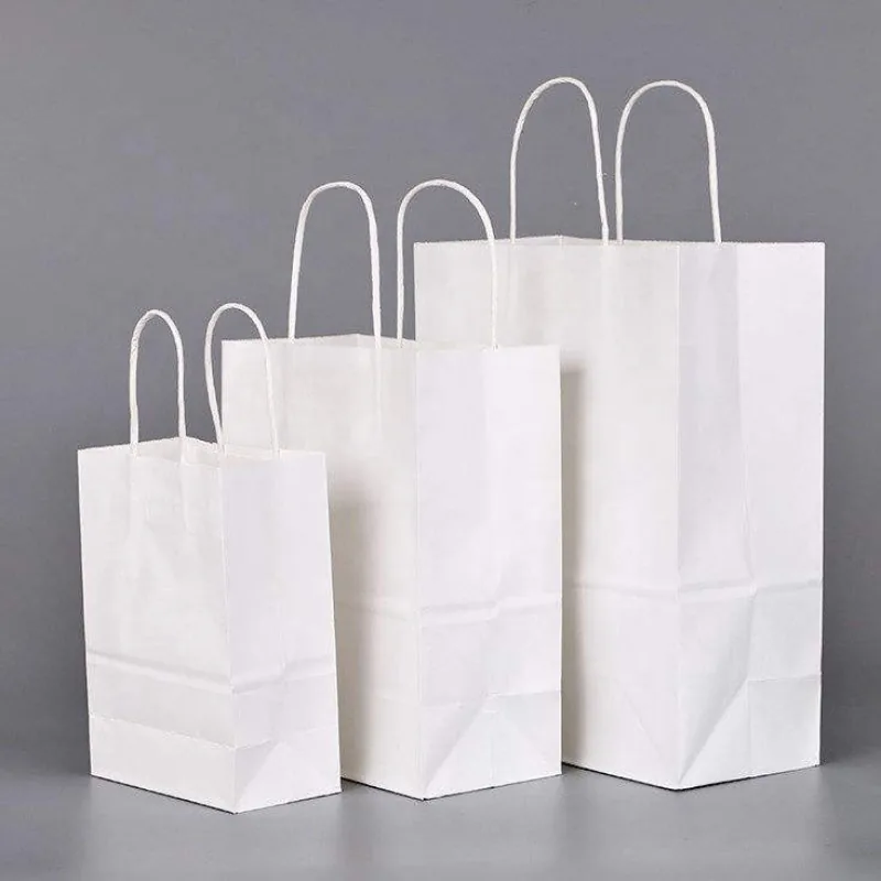 White kraft paper bags in multiple sizes with twisted paper handles